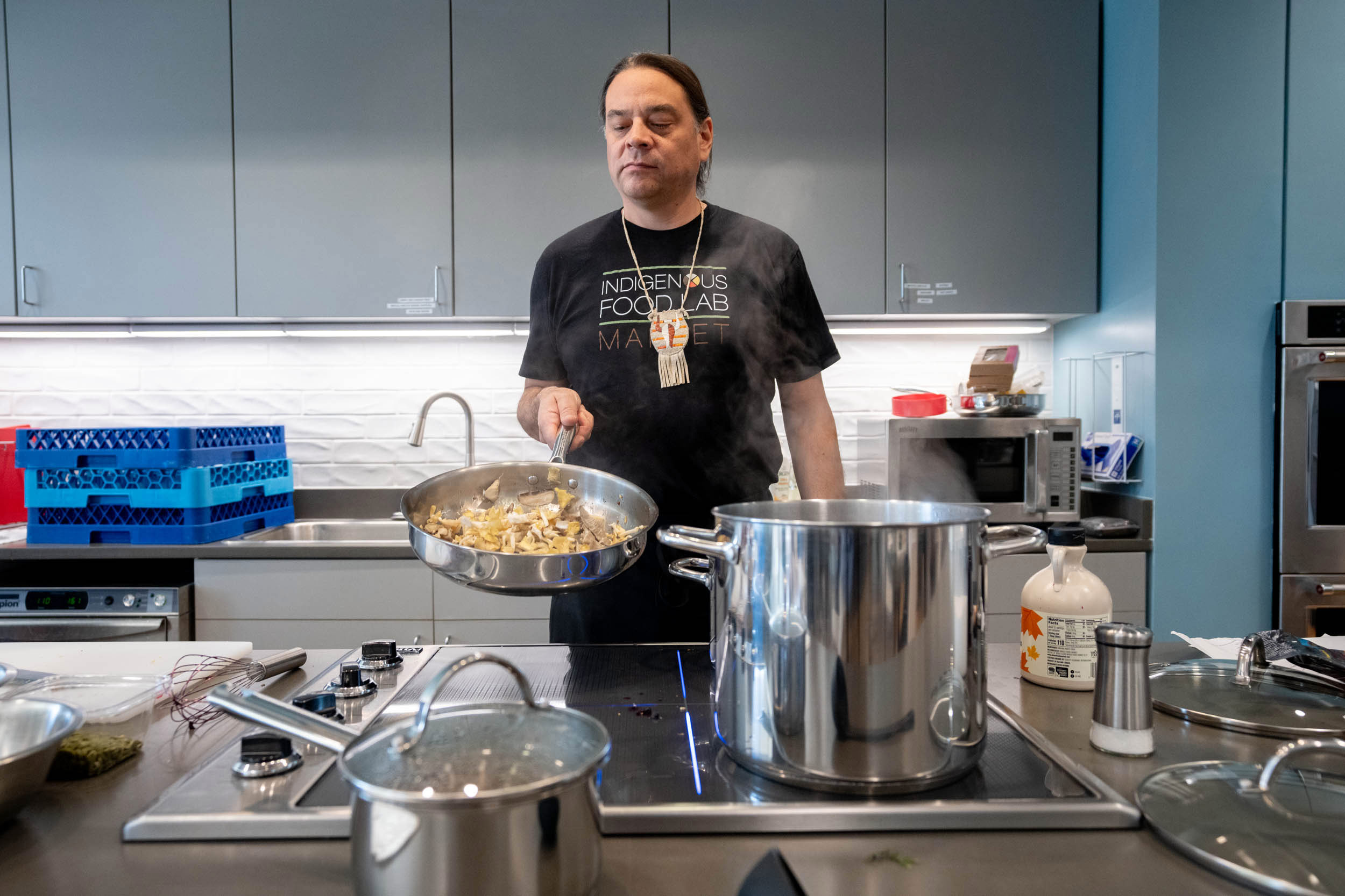The “Sioux Chef,” Sean Sherman, demonstrates how to sauté mushrooms in the University’s teaching kitchen. (Photo by Sanjay Suchak, University Communications)